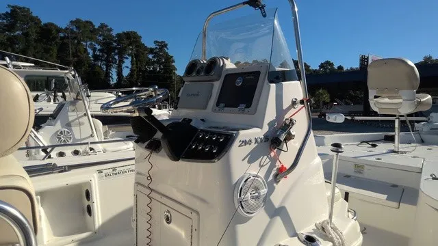 Slide: The Image of A 2016 NauticStar 214 featuring a modern helm station and comfortable outdoor seating. - 10