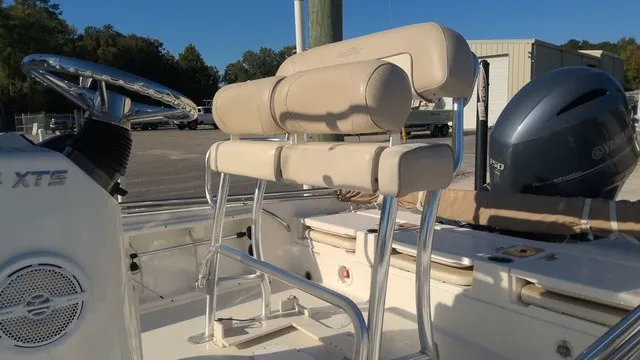 Slide: The Image of The image shows the cockpit of a 2016 NauticStar 214 boat with beige upholstered seating. - 5