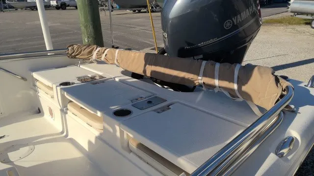 Slide: The Image of The image shows the deck of a 2016 NauticStar 214 boat with a Yamaha engine. - 6