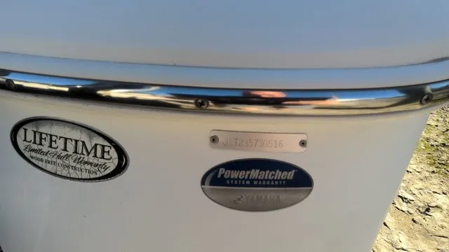 Slide: The Image of Close-up of a boat hull with warranty plaques and a serial number. - 8