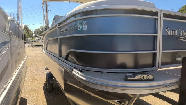 Slide: The Image of A 2023 SunCatcher Select 20C pontoon boat is on a trailer outdoors. - 4