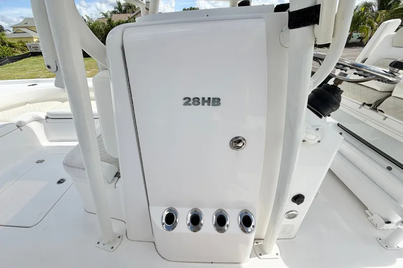 Slide: The Image of 2021 Caymas 28 HB boat interior with rod holders and seating. - 17