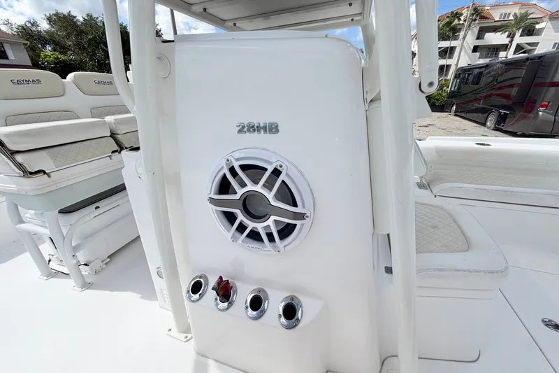 Slide: The Image of 2021 Caymas 28 HB boat interior with speaker and seating. - 16