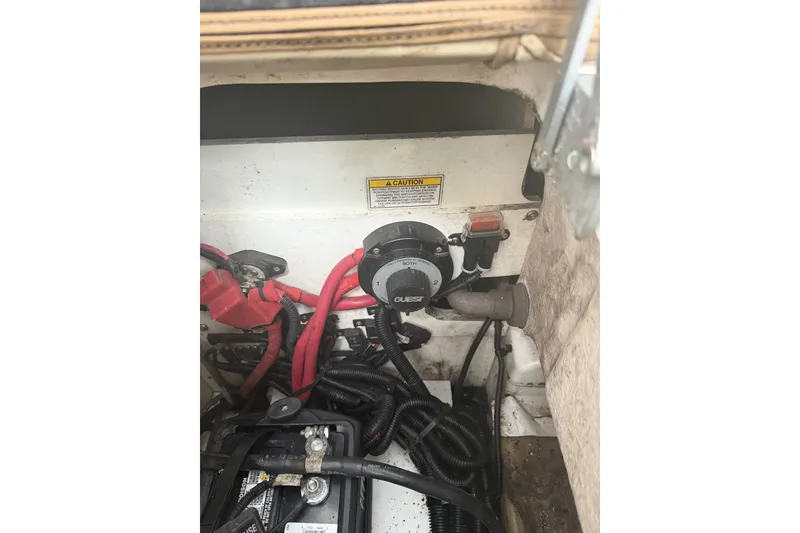 Slide: The Image of Electrical components and wiring inside a 2015 Sea Ray SDX 270 Outboard boat. - 46