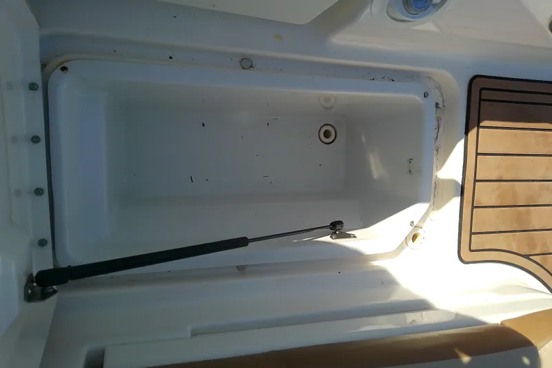 Slide: The Image of Open storage compartment on a 2015 Sea Ray SDX 270 Outboard boat. - 36
