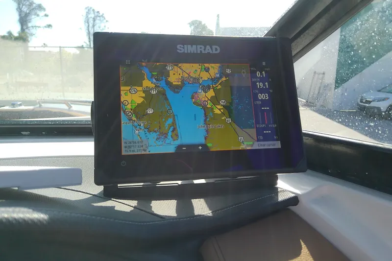 Slide: The Image of Simrad navigation display on 2015 Sea Ray SDX 270 Outboard boat, showing coastal map. - 27