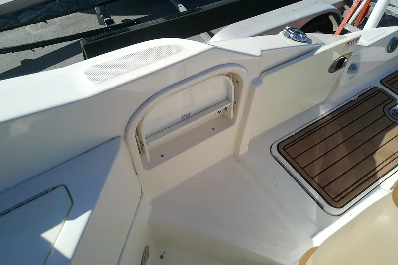 Slide: The Image of Interior view of a 2015 Sea Ray SDX 270 Outboard boat, featuring seating and deck details. - 42