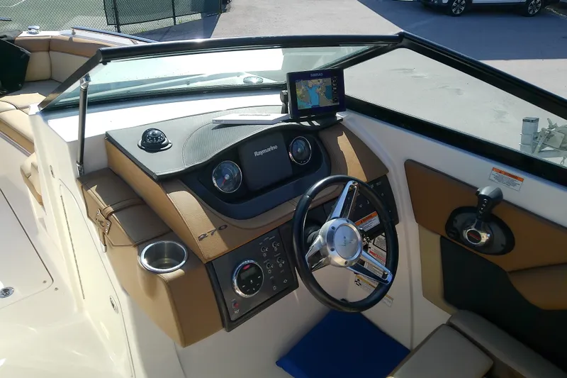 Slide: The Image of 2015 Sea Ray SDX 270 Outboard boat dashboard with steering wheel and navigation system. - 24
