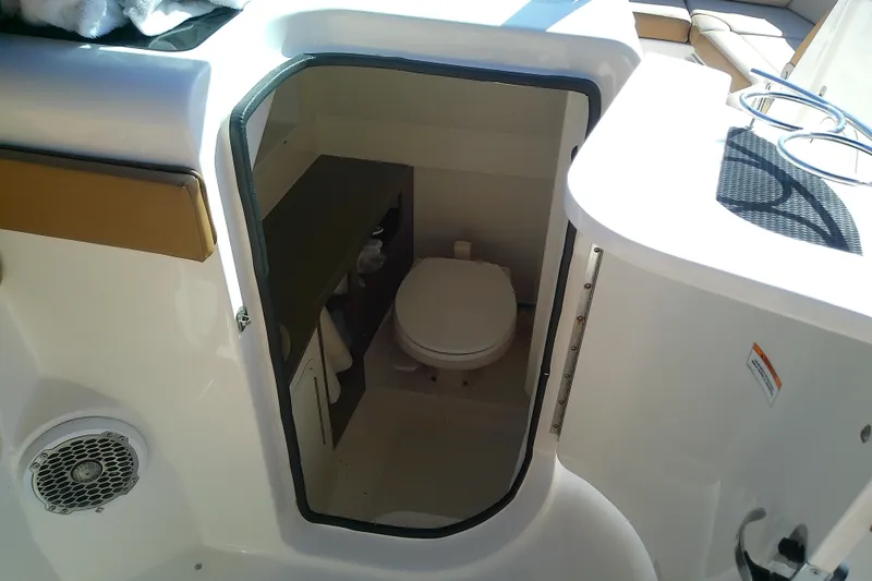 Slide: The Image of Interior view of 2015 Sea Ray SDX 270 Outboard boat's compact bathroom. - 37