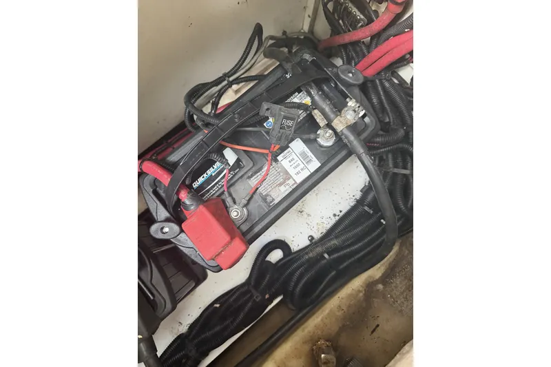 Slide: The Image of Battery compartment of a 2015 Sea Ray SDX 270 Outboard boat with wiring connections. - 47