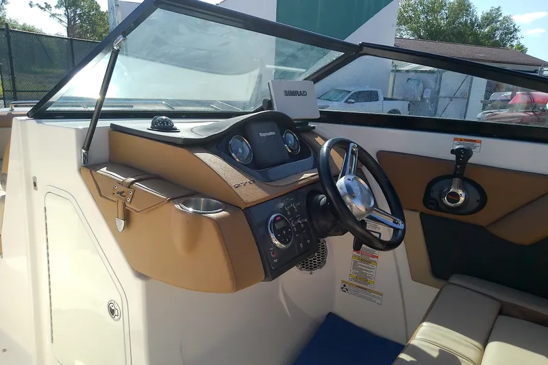 Slide: The Image of 2015 Sea Ray SDX 270 Outboard boat dashboard with steering wheel and controls. - 40