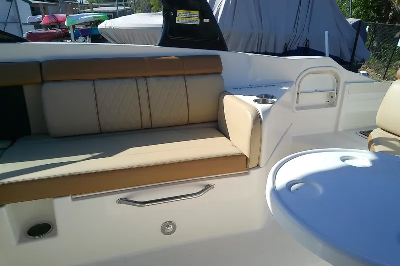 Slide: The Image of Interior seating of 2015 Sea Ray SDX 270 Outboard boat with beige upholstery. - 20