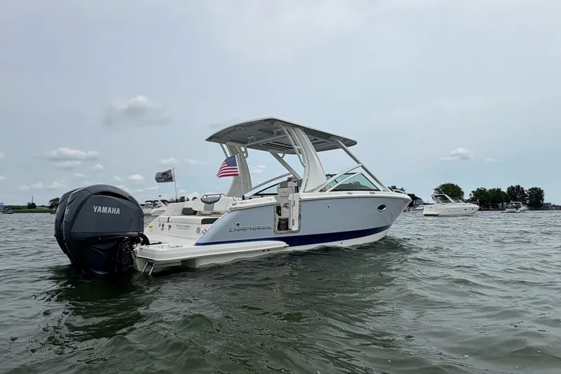 Slide: The Image of 2023 Chaparral 280 OSX boat with Yamaha engine on a lake. - 17
