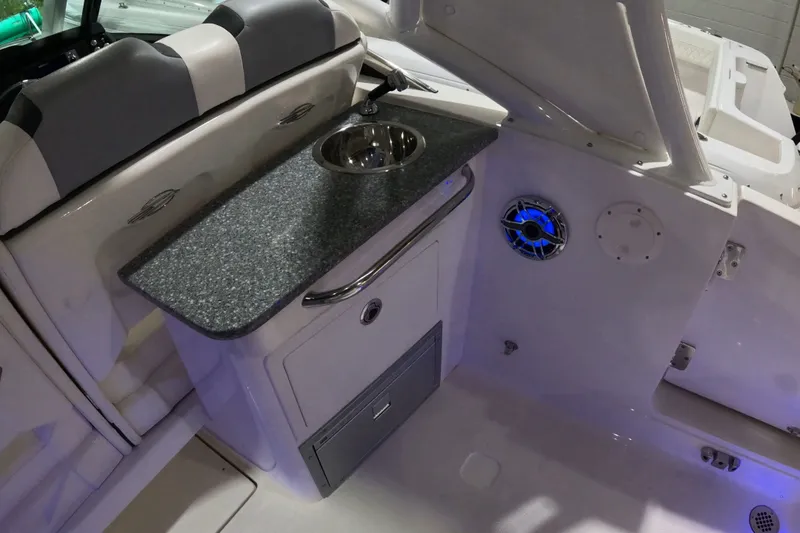 Slide: The Image of 2023 Chaparral 280 OSX boat interior with sink and speaker system. - 9