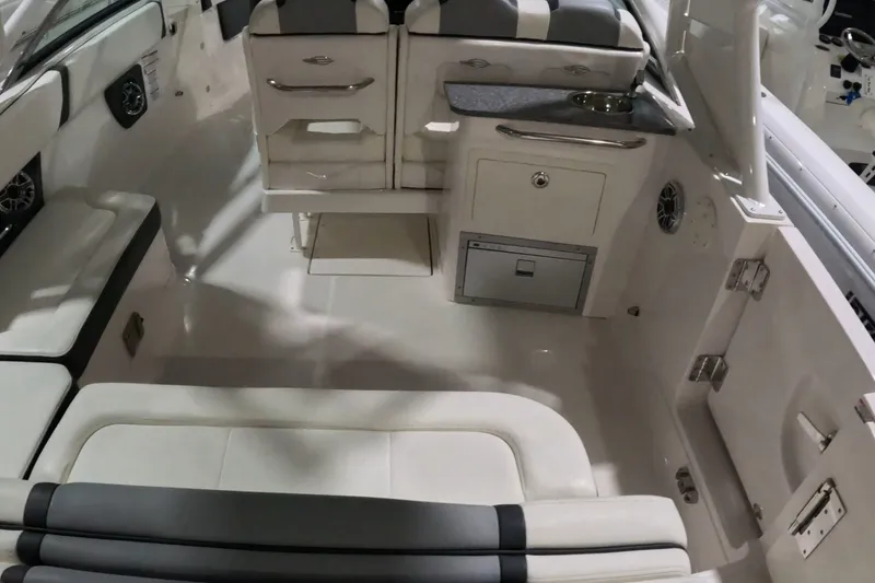 Slide: The Image of 2023 Chaparral 280 OSX boat interior with seating and storage compartments. - 14