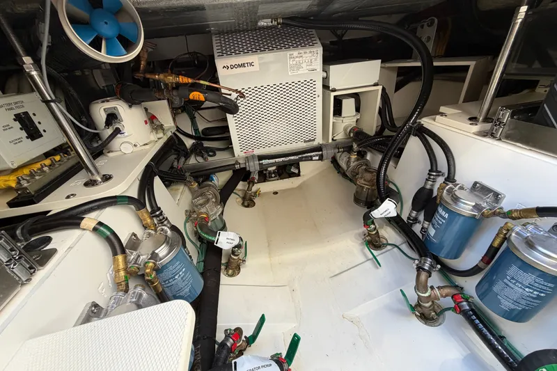 Slide: The Image of Engine compartment of 2023 Pursuit S 428 Sport boat with Dometic equipment and fuel filters. - 32