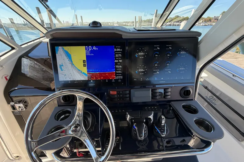 Slide: The Image of 2023 Pursuit S 428 Sport boat dashboard with advanced navigation and control systems. - 18