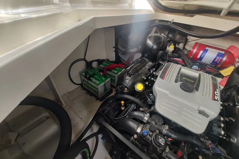 Slide: The Image of Engine compartment of a 2012 Sea Ray Sundancer 310 with batteries and fire extinguisher. - 30