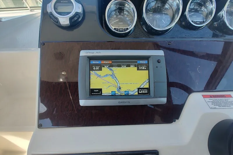 Slide: The Image of Dashboard of a 2012 Sea Ray Sundancer 310 with Garmin GPS and gauges. - 13