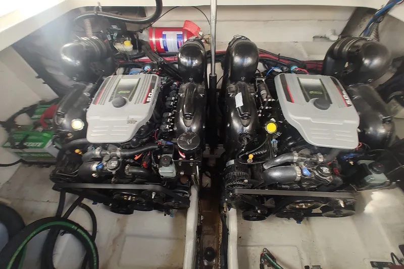 Slide: The Image of Twin engines in a 2012 Sea Ray Sundancer 310 boat engine compartment. - 35