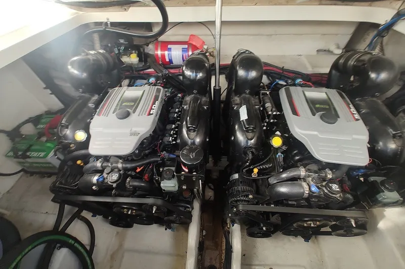 Slide: The Image of Twin engines in a 2012 Sea Ray Sundancer 310 boat engine compartment. - 33