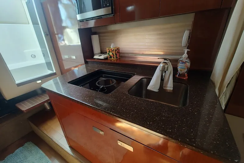 Slide: The Image of Luxurious galley kitchen in 2012 Sea Ray Sundancer 310 yacht with modern amenities. - 25