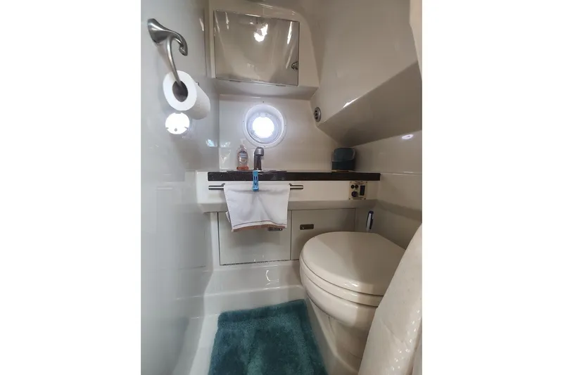 Slide: The Image of Bathroom interior of 2012 Sea Ray Sundancer 310 yacht, featuring compact design and amenities. - 29