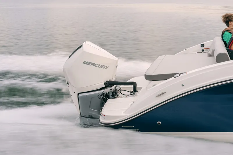 Slide: The Image of The image shows a 2027 Sea Ray SDX 250 Outboard boat on the water. - 40