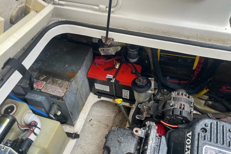 Slide: The Image of Engine compartment of a 2008 Regal 2565 Express Cruiser with battery and mechanical components. - 15