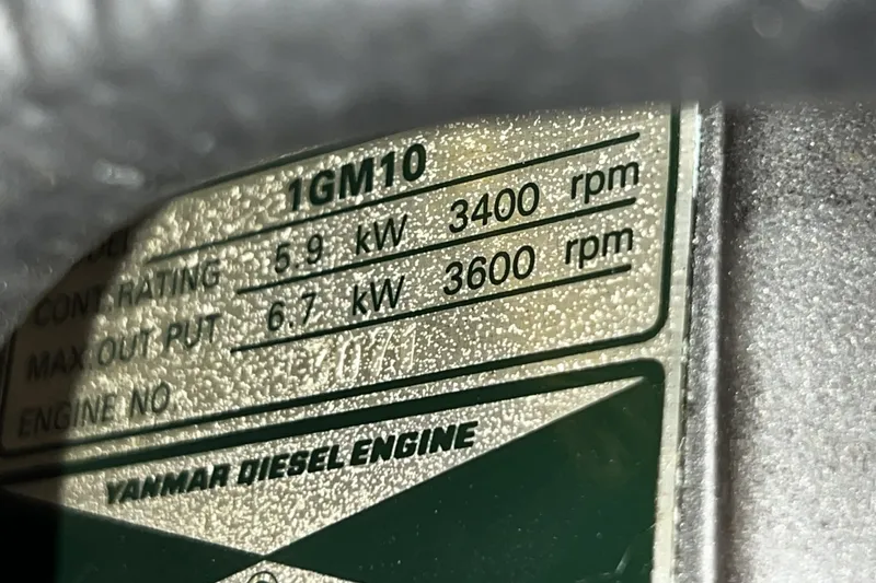 Slide: The Image of Yanmar diesel engine label showing power ratings for Alerion Express 28, 1995 model. - 44