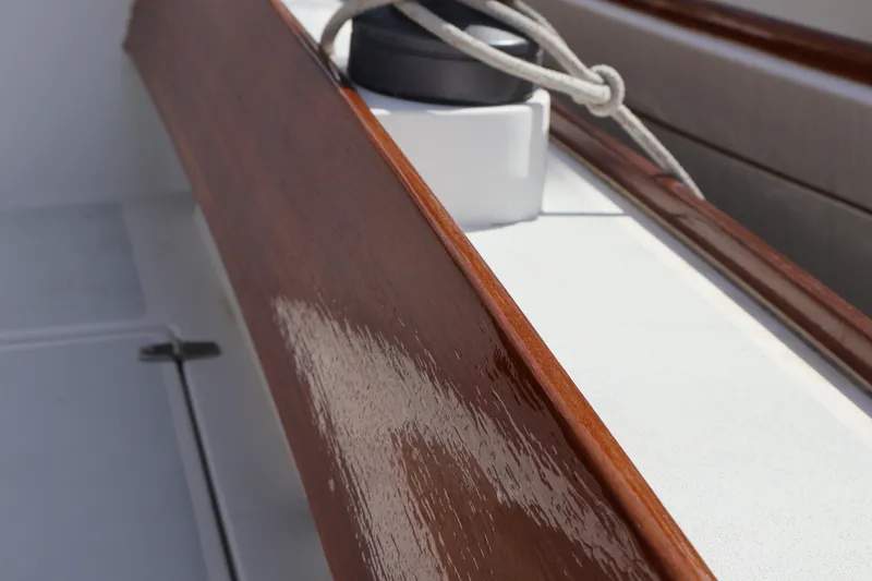 Slide: The Image of Close-up of polished wood detail on a 1995 Alerion Express 28 sailboat. - 11