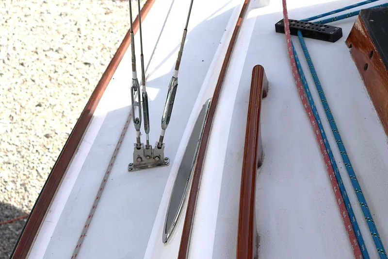 Slide: The Image of Deck details of a 1995 Alerion Express 28 sailboat, featuring rigging and ropes. - 20