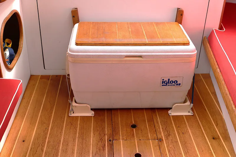 Slide: The Image of Wooden boat interior with Igloo Marine cooler on Alerion Express 28, 1995 model. - 38