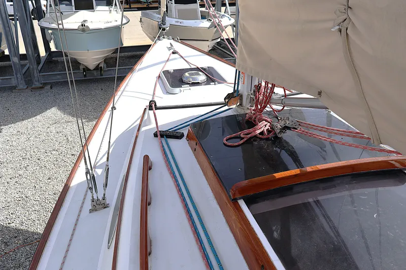 Slide: The Image of 1995 Alerion Express 28 sailboat deck with rigging and covered sail. - 21