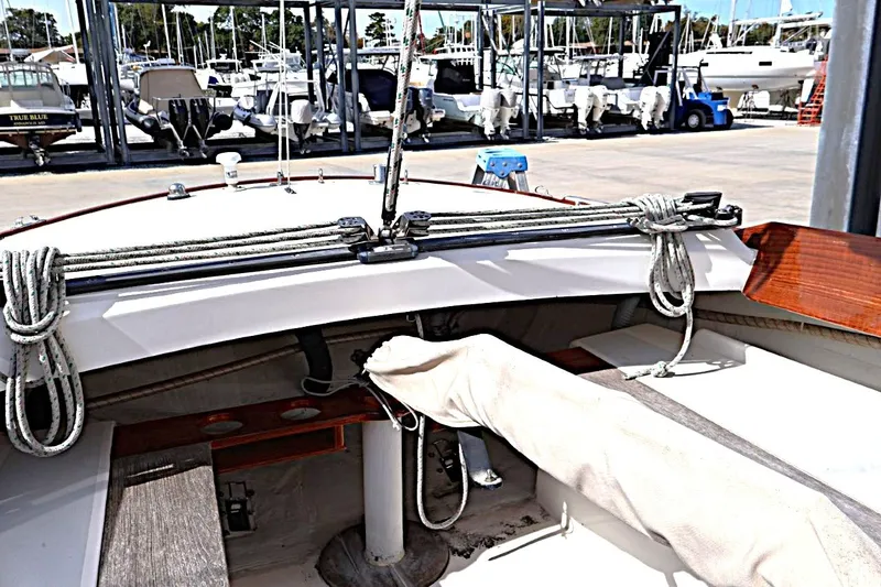 Slide: The Image of Cockpit view of a 1995 Alerion Express 28 sailboat at a marina. - 15