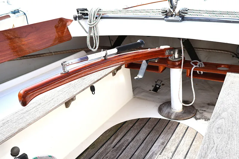 Slide: The Image of Cockpit of 1995 Alerion Express 28 sailboat with wooden tiller and ropes. - 16