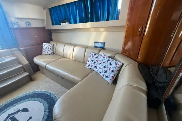 Slide: The Image of Luxurious interior of 2005 Carver 360 Mariner with beige leather seating and nautical decor. - 45