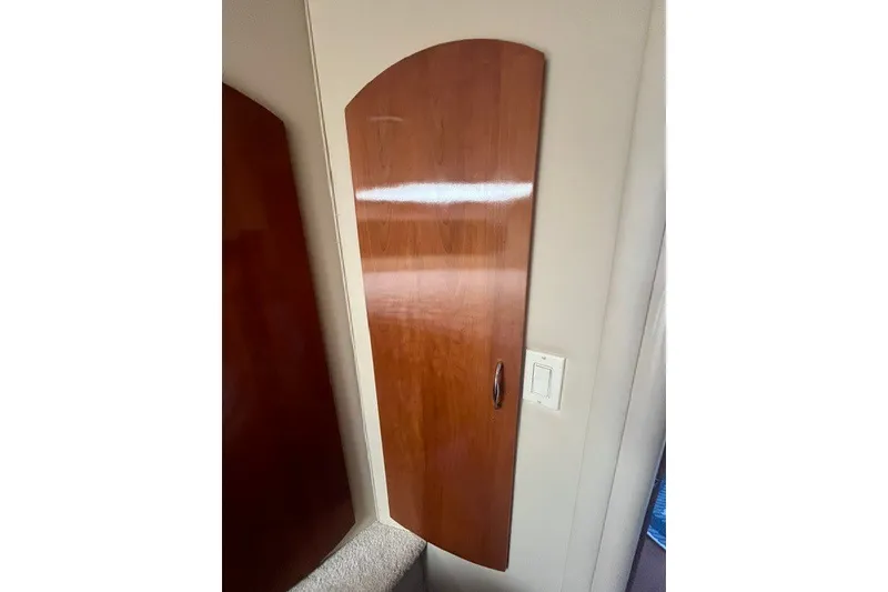 Slide: The Image of Wooden cabinet door inside 2005 Carver 360 Mariner yacht interior. - 56