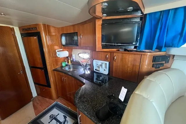 Slide: The Image of Interior of 2005 Carver 360 Mariner yacht with kitchenette and TV. - 37