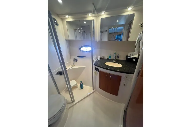 Slide: The Image of Bathroom interior of 2005 Carver 360 Mariner yacht, featuring modern fixtures and lighting. - 47