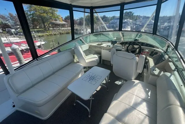 Slide: The Image of Interior of 2005 Carver 360 Mariner yacht with white seating and helm. - 11