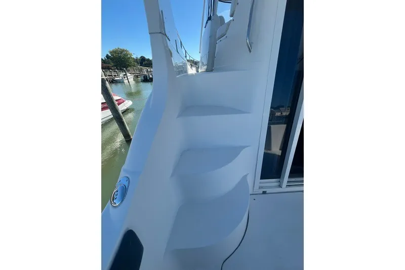 Slide: The Image of Staircase on 2005 Carver 360 Mariner yacht, docked by the water. - 4