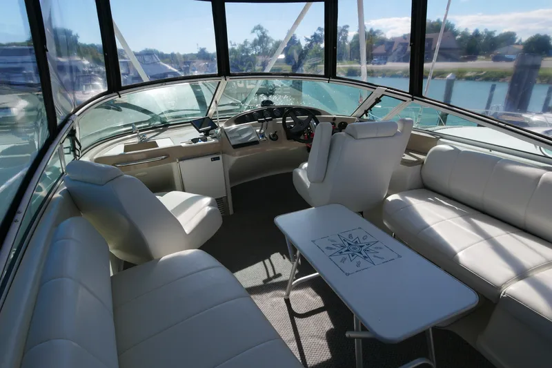 Slide: The Image of Interior of 2005 Carver 360 Mariner yacht with white seating and helm station. - 13