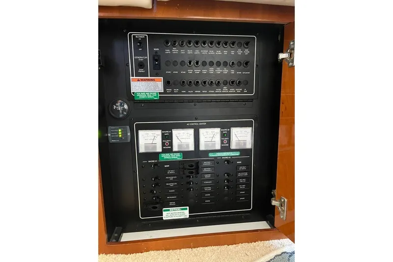 Slide: The Image of Electrical control panel inside a 2005 Carver 360 Mariner yacht. - 58
