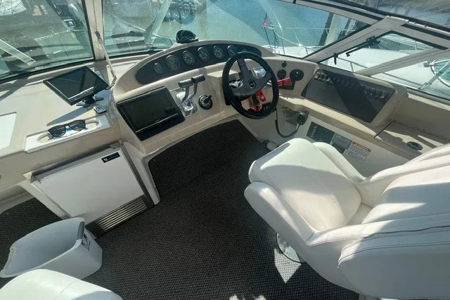 Slide: The Image of Interior cockpit of 2005 Carver 360 Mariner yacht with modern controls and seating. - 21