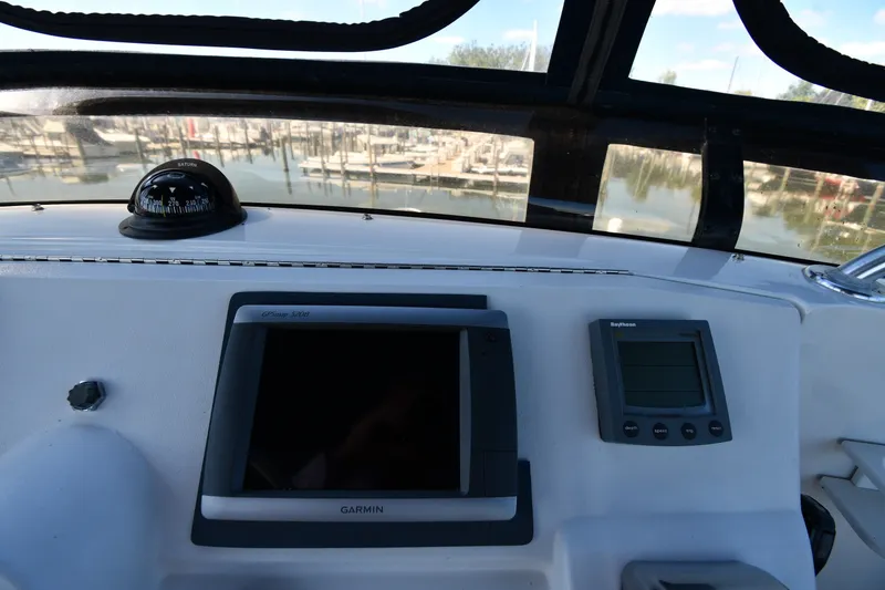 Slide: The Image of Helm of 2000 Mainship 390 Trawler with Garmin and Raytheon navigation equipment. - 18