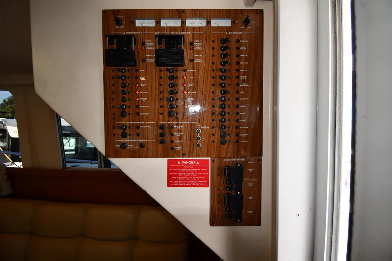 Slide: The Image of Electrical control panel on a 2000 Mainship 390 Trawler boat interior. - 52