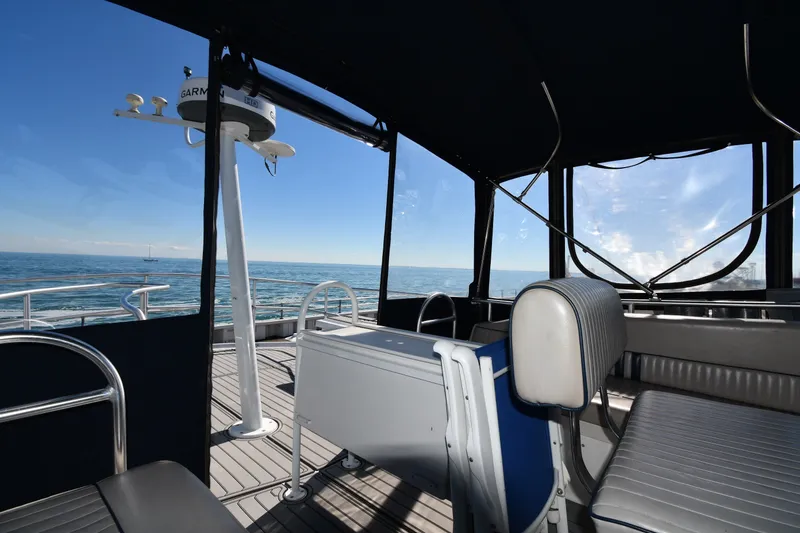 Slide: The Image of Interior view of 2000 Mainship 390 Trawler with ocean backdrop. - 23
