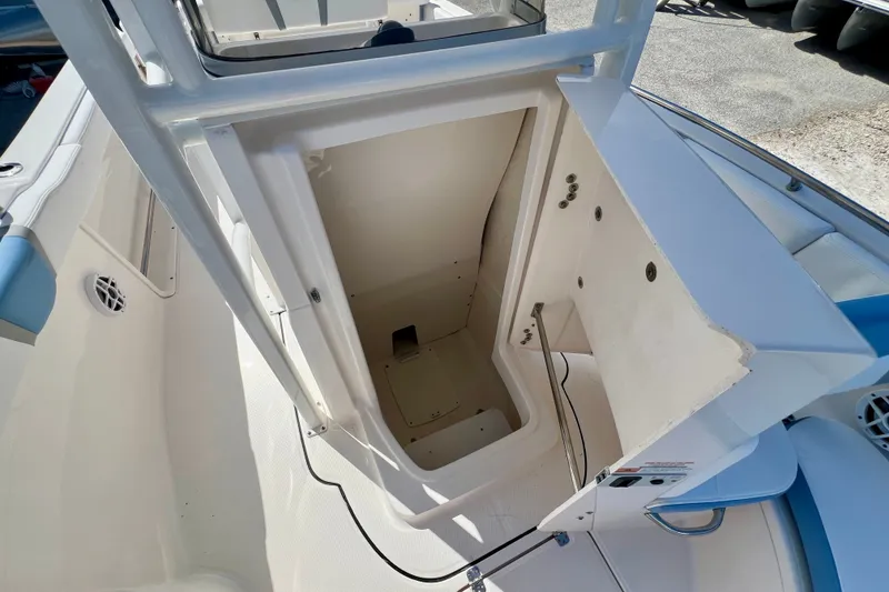 Slide: The Image of 2024 Robalo R222 Center Console boat storage compartment, open and empty. - 20