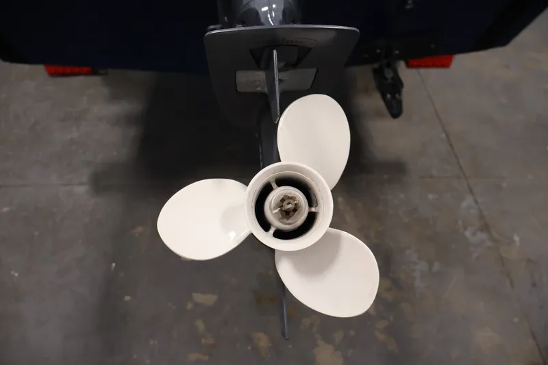 Slide: The Image of 2019 Polar Kraft Outlander 156 T boat propeller on concrete floor. - 26